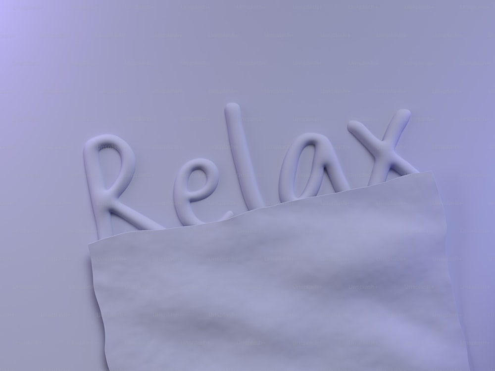 a close up of a piece of paper with the word relax on it
