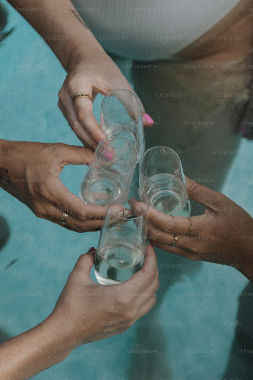 a group of people holding wine glasses in their hands