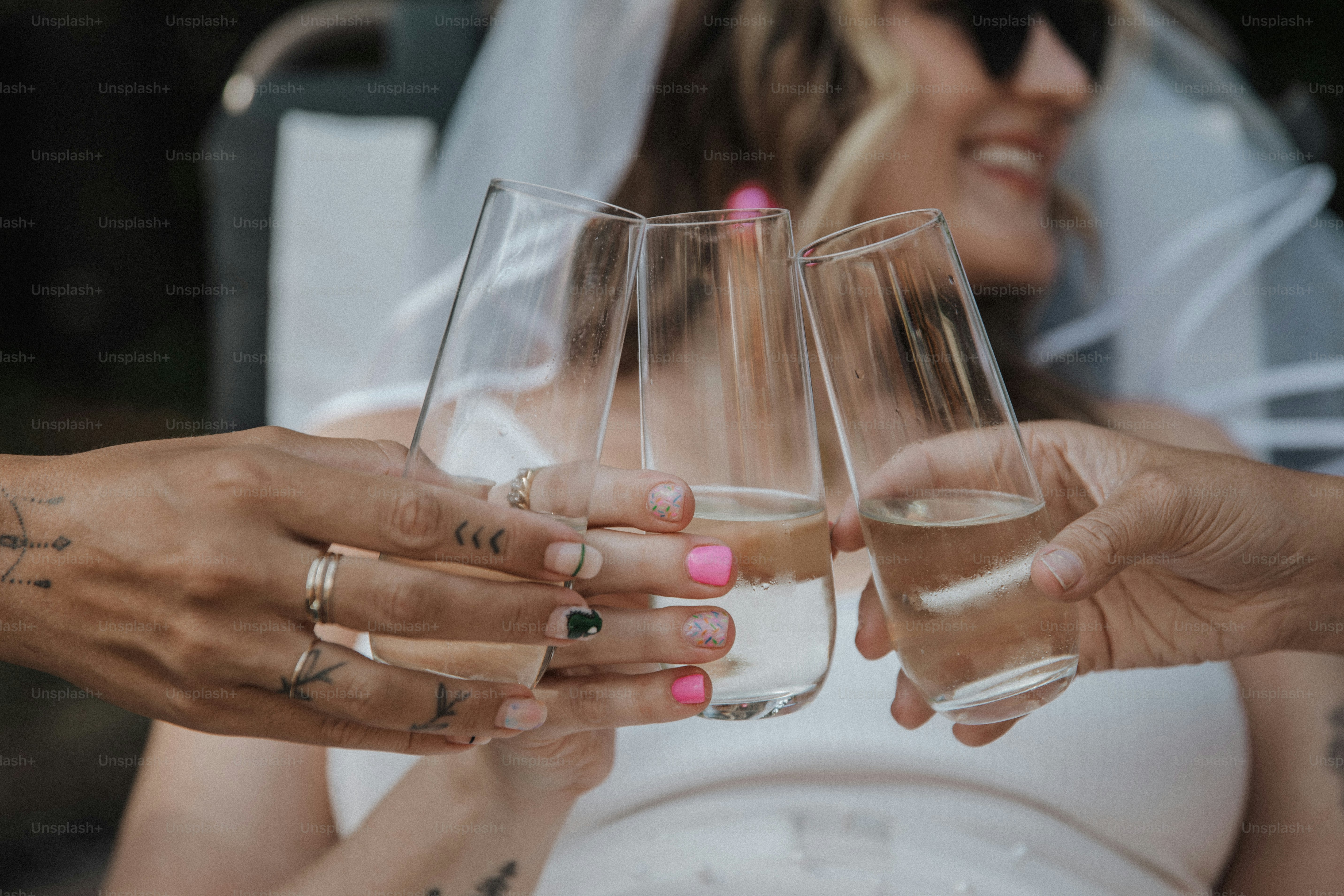 a couple of people that are holding wine glasses