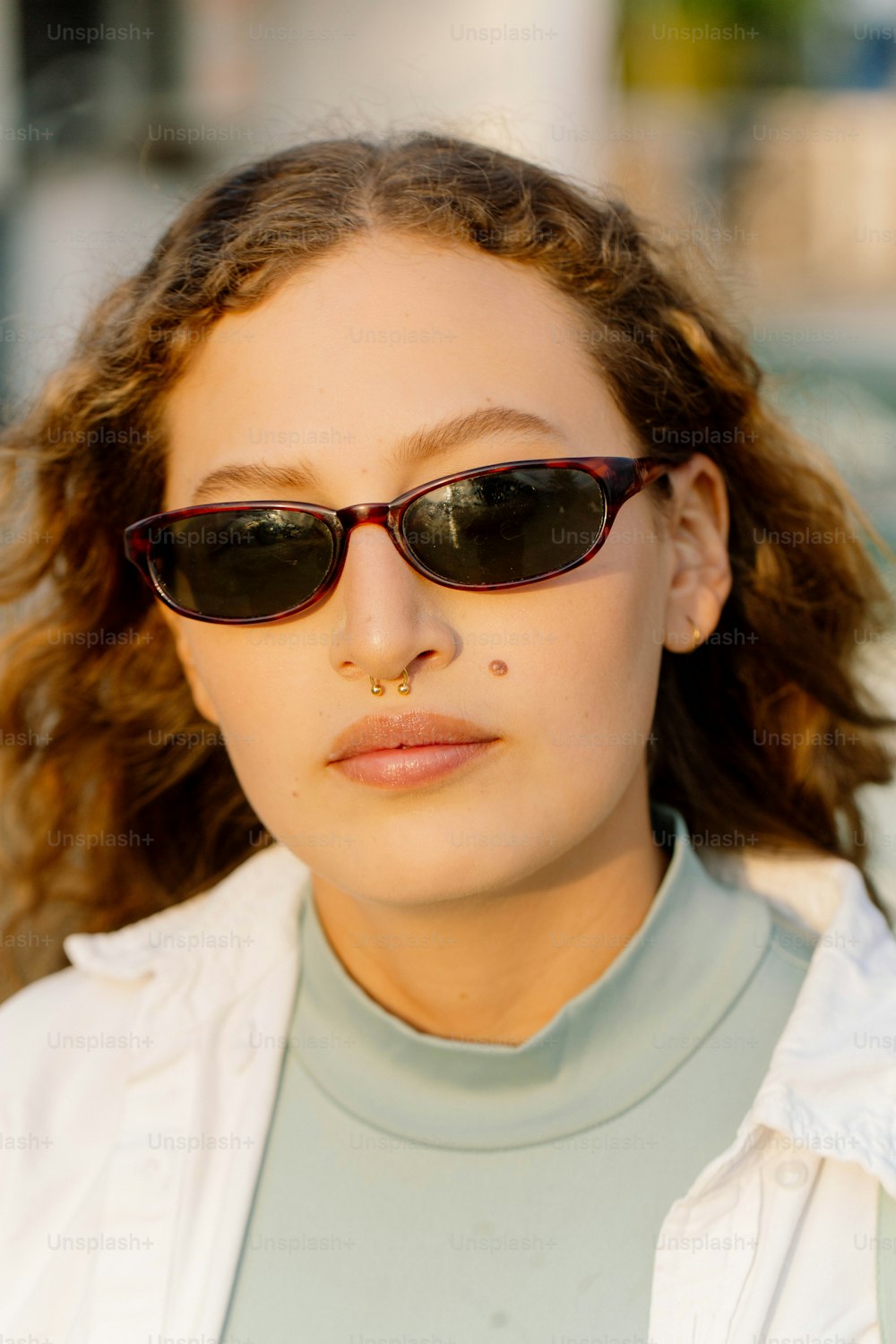 a close up of a person wearing sunglasses