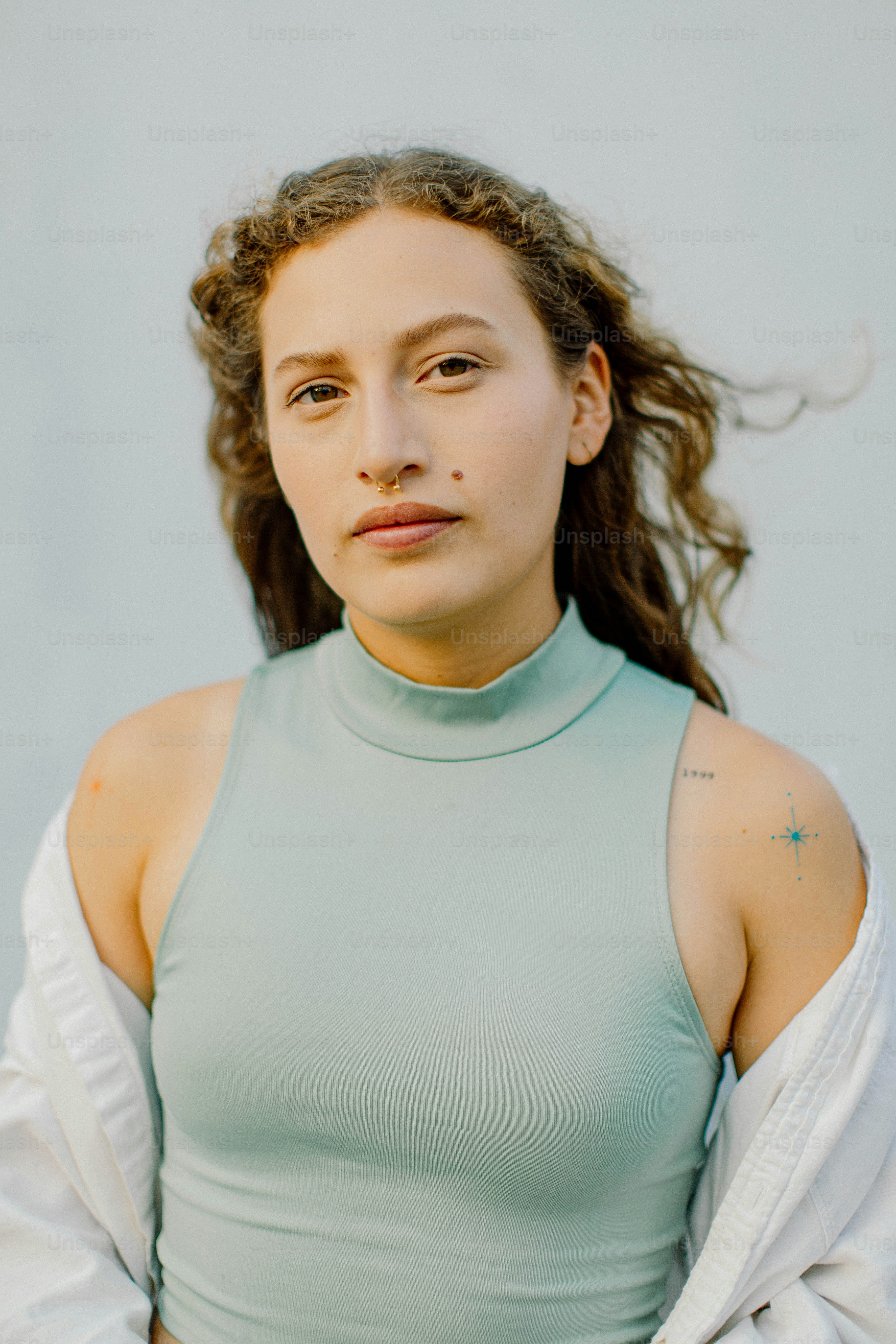 a woman with a tattoo on her arm