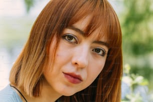 a close up of a woman with red hair