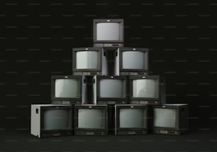 a stack of old televisions sitting on top of each other