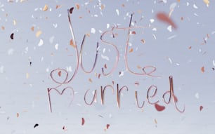 the words just married are surrounded by confetti