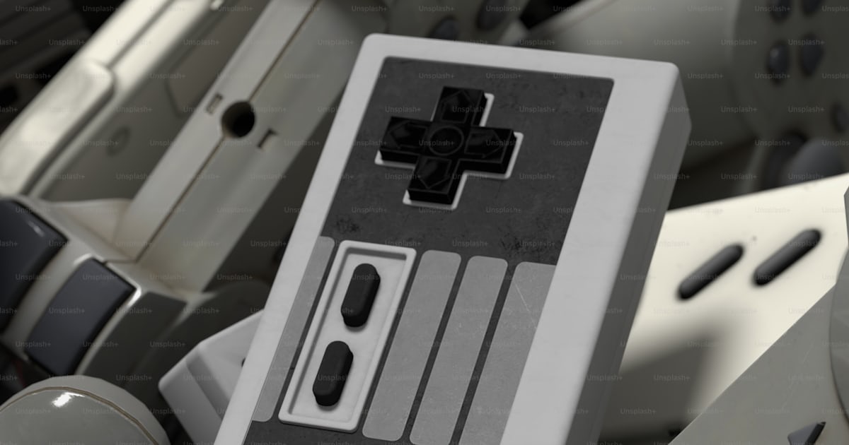 A close up of a nintendo controller surrounded by other nintendo ...