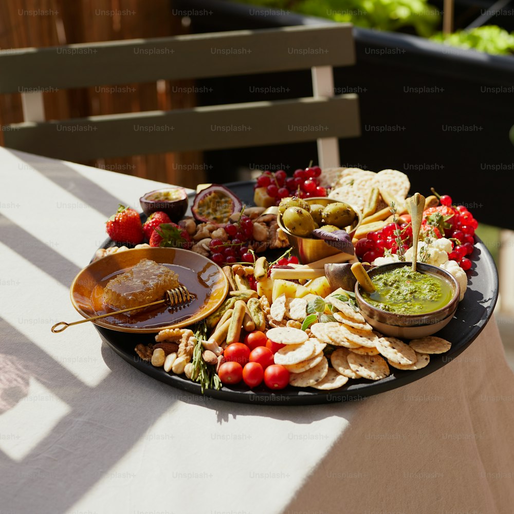 a platter of appetizers and dips on a table