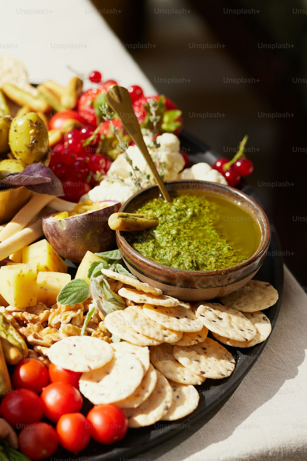 a platter of crackers, crackers, and vegetables