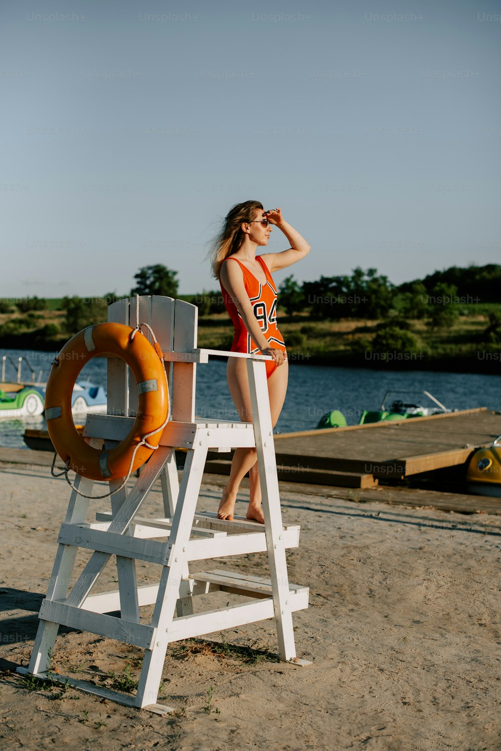 a woman in a bathing suit standing on a life preserver