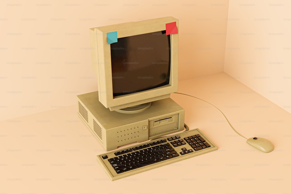um computador antigo com teclado e mouse