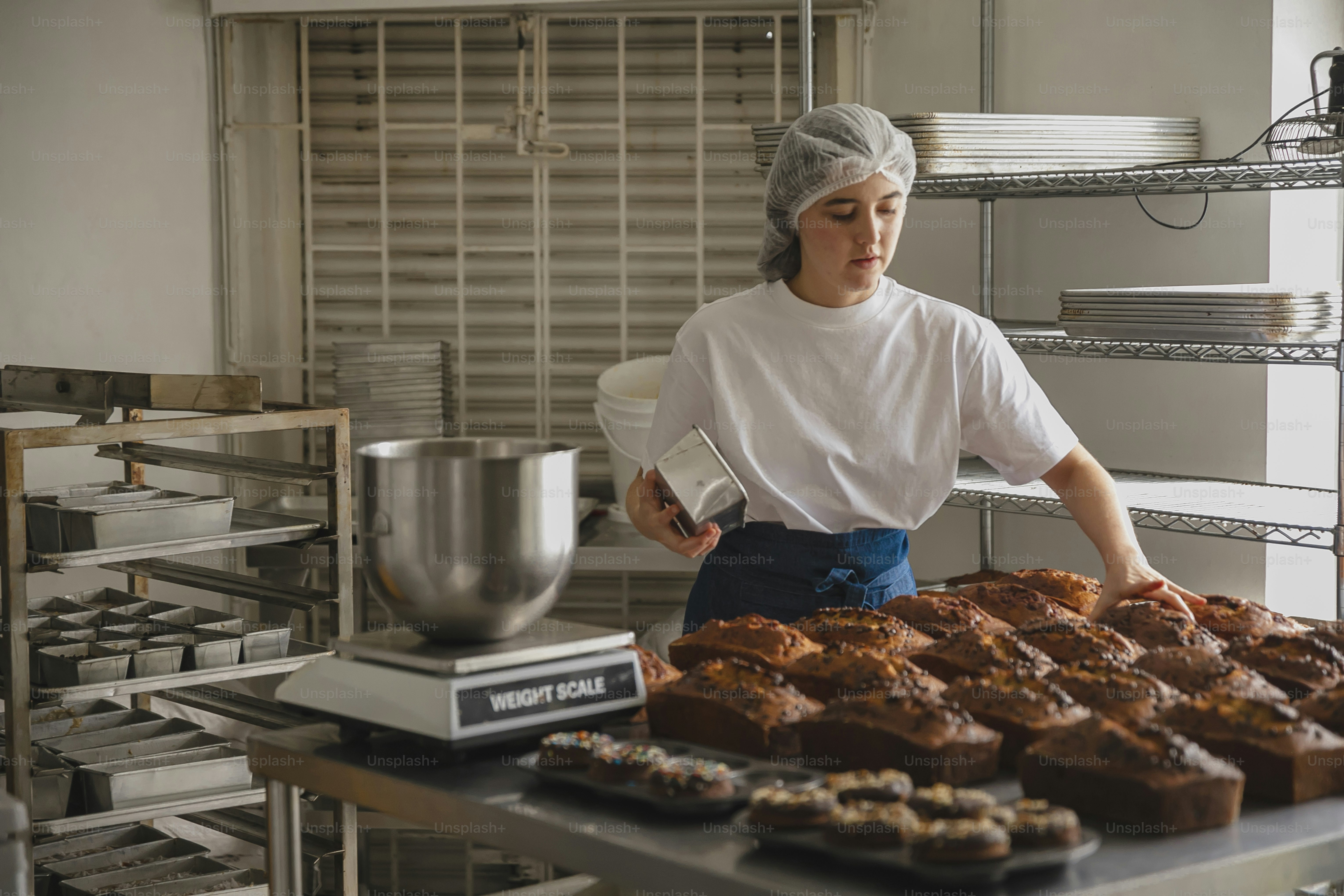 a woman in a white shirt and a tray of food