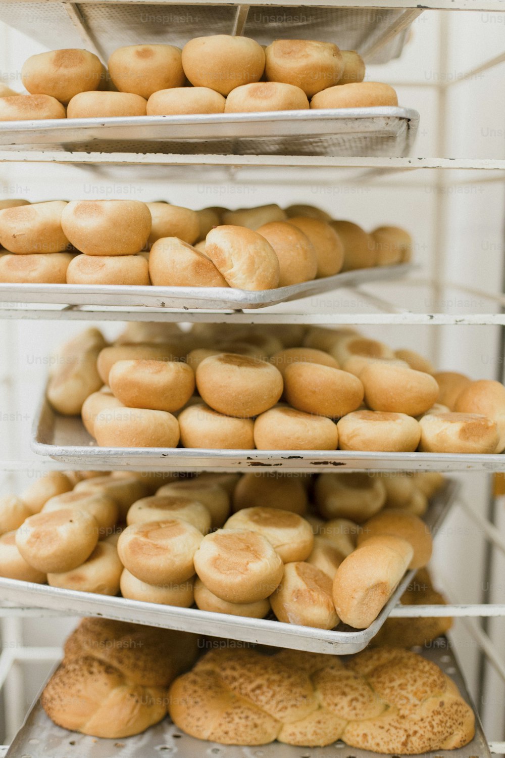 a bunch of breads that are on a rack