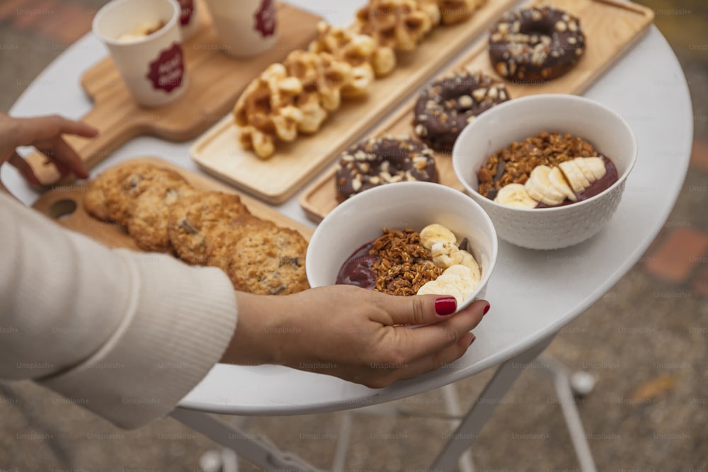 a table topped with donuts and other desserts