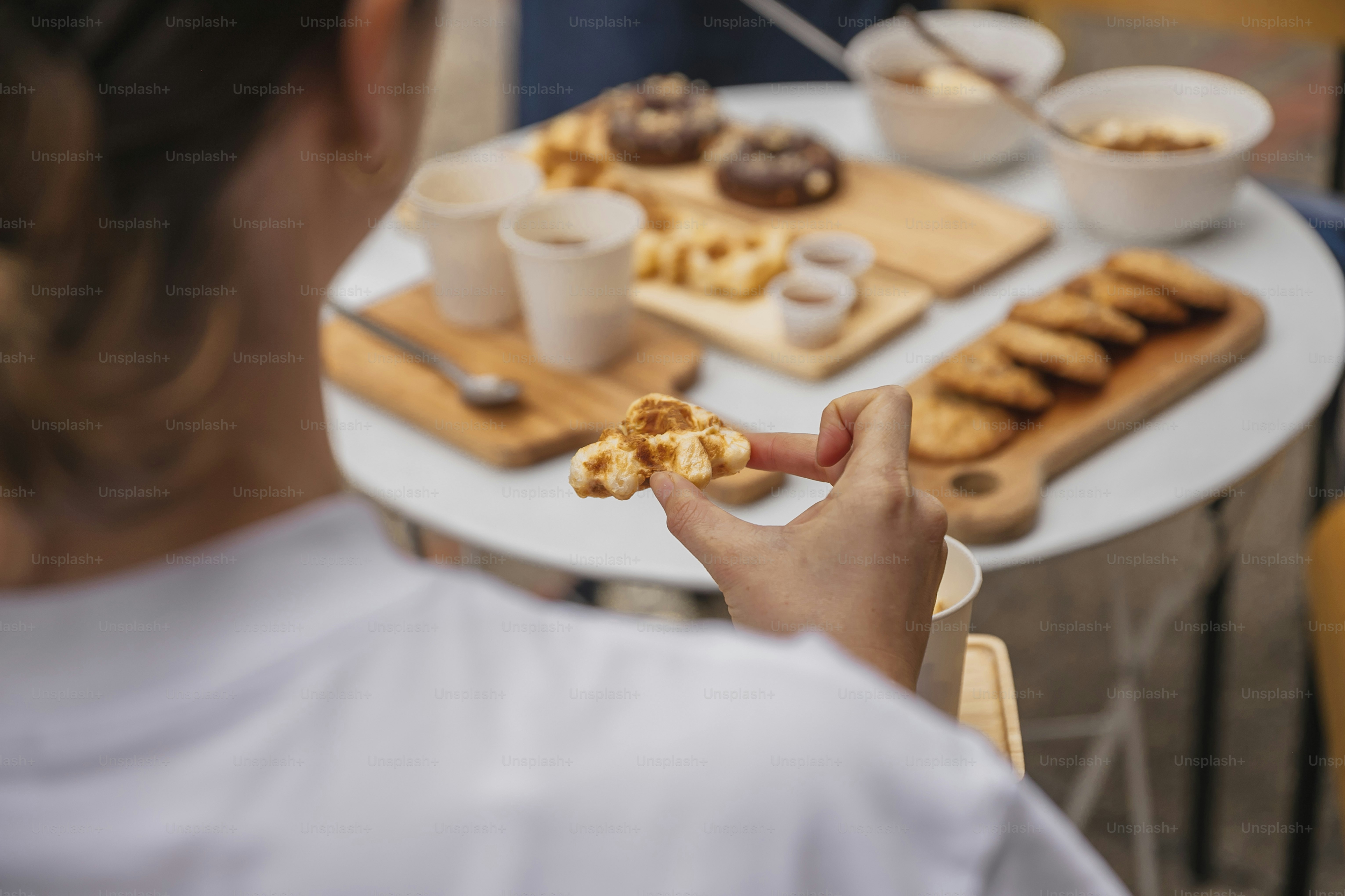 a person holding a piece of food in their hand