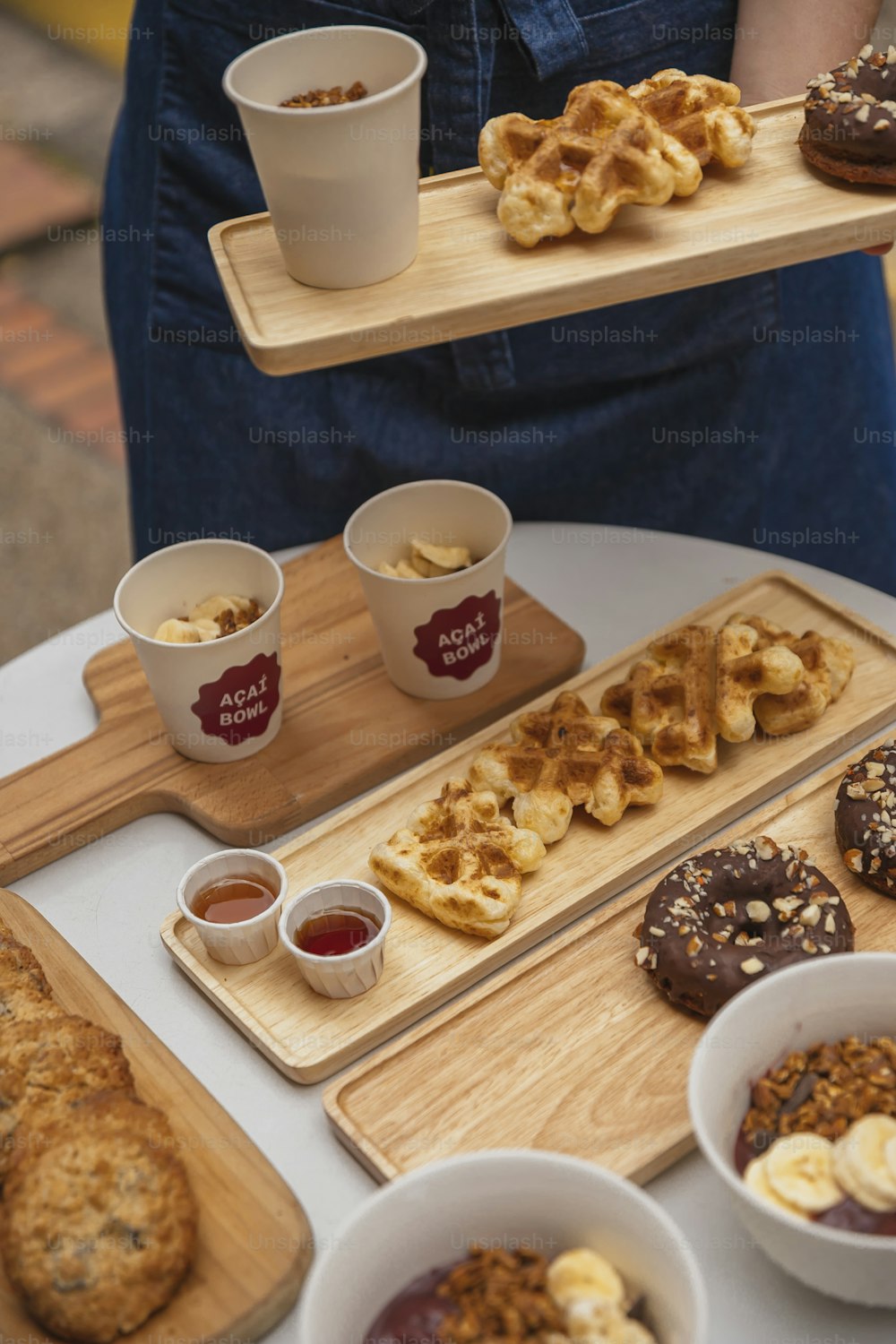 a table topped with plates of food and cups of coffee