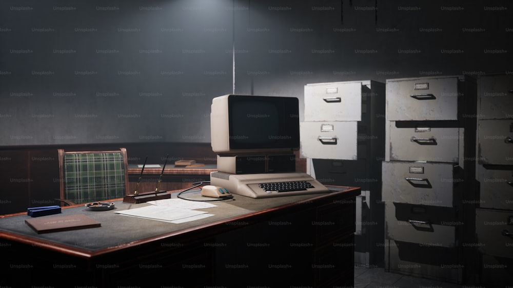 컴퓨터 모니터, 키�보드 및 파일 캐비닛이 있는 책상