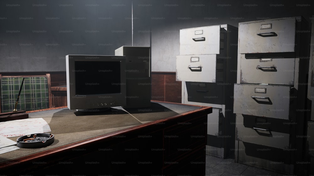 a computer monitor sitting on top of a wooden desk