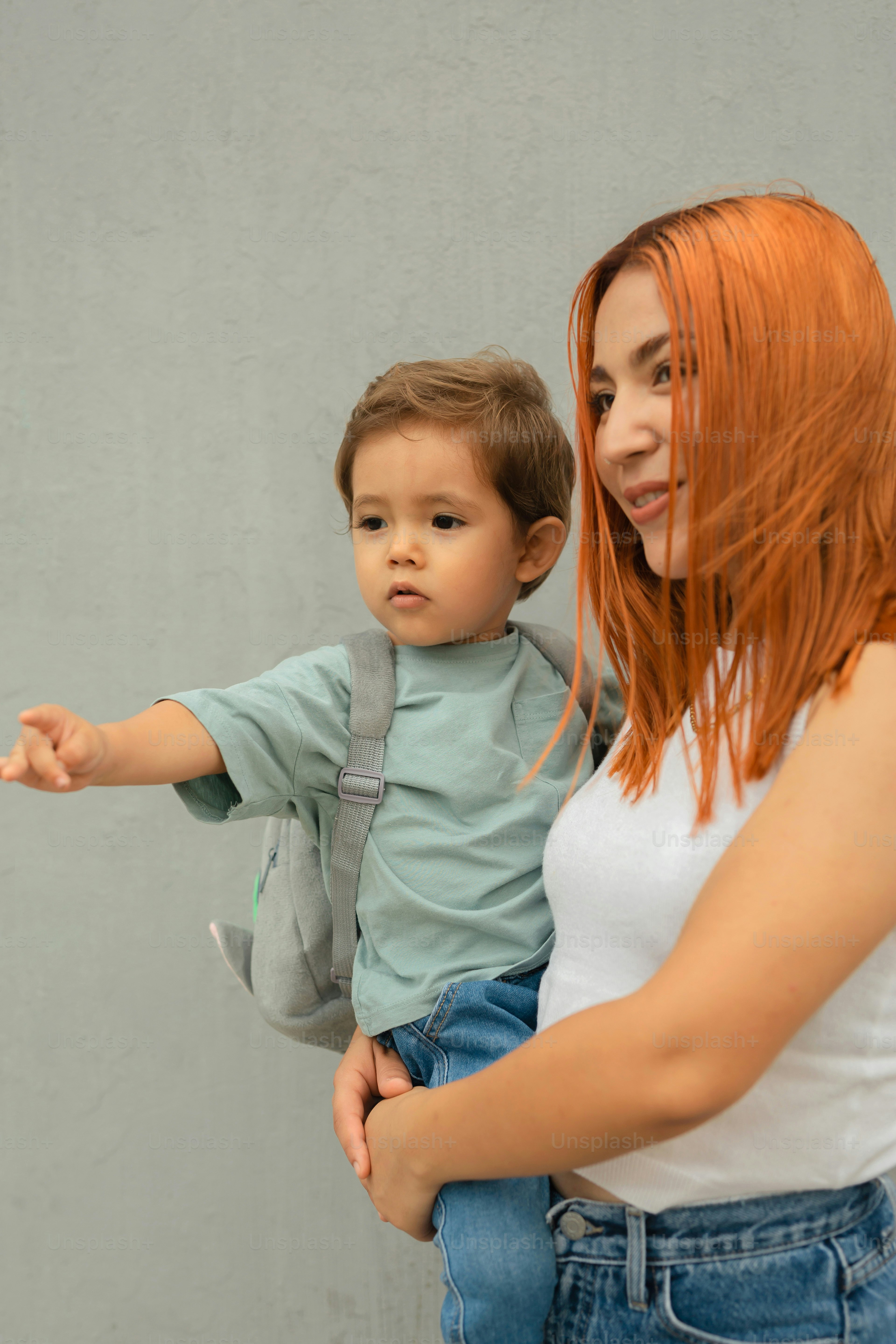 a woman holding a small child in her arms