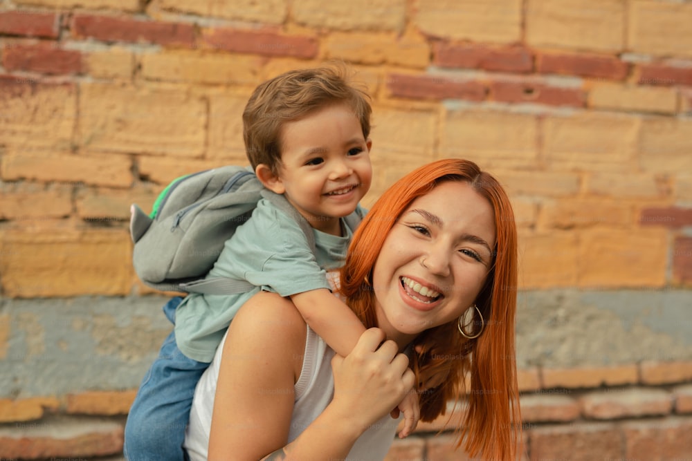 a woman carrying a child on her back