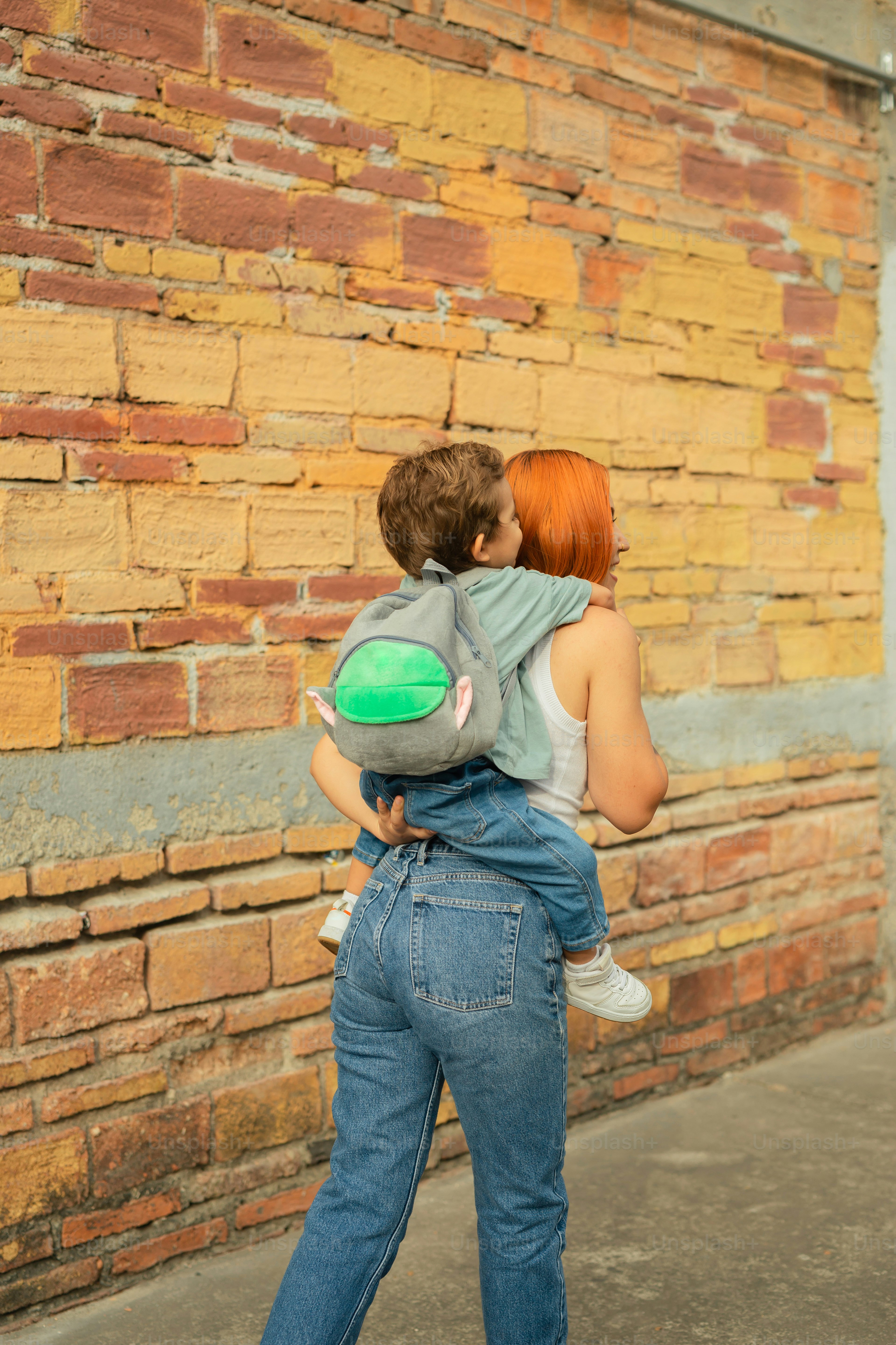 a woman carrying a child on her back