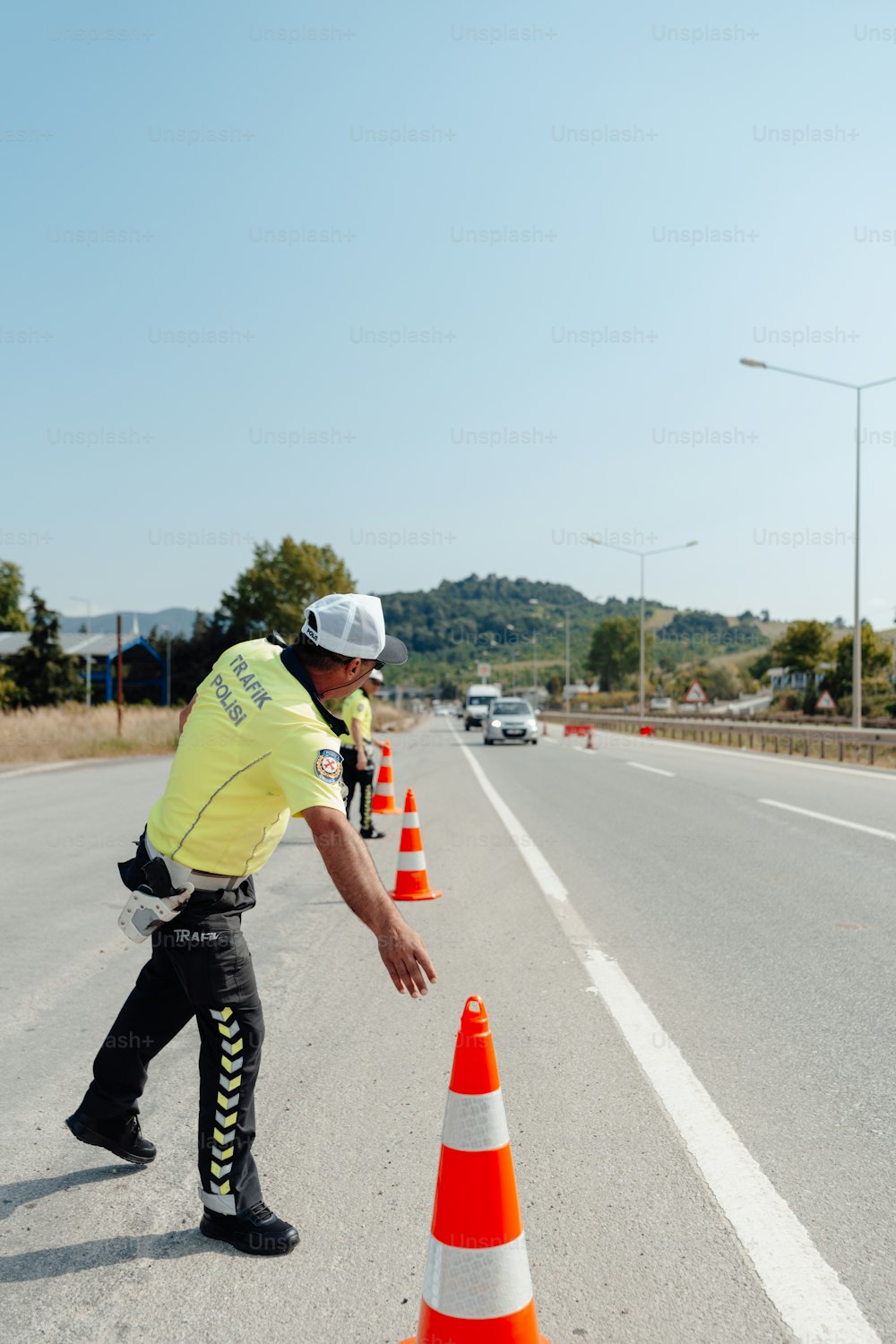 a police officer directing traffic on a highway
