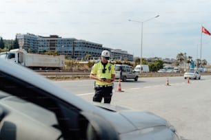 a police officer standing on the side of a road