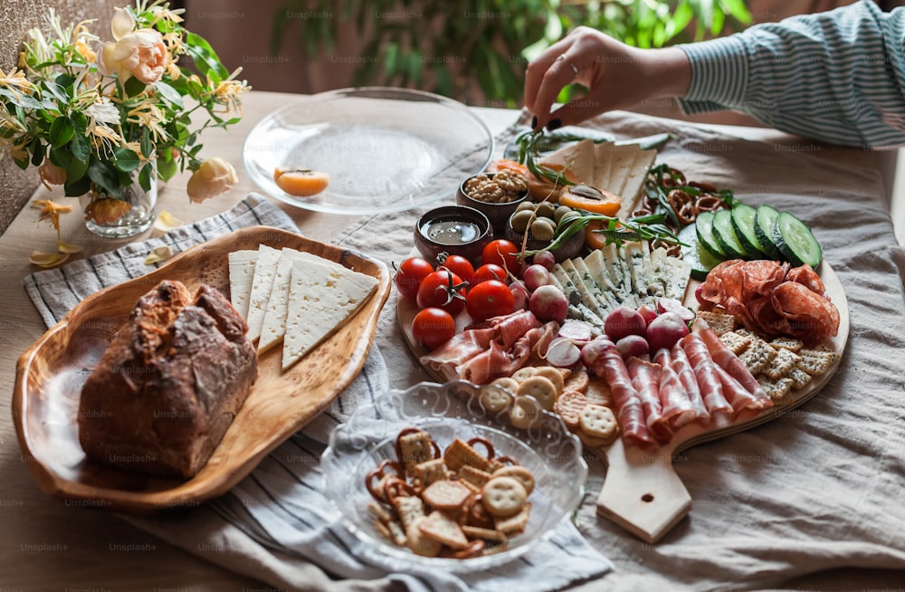 a platter of meats and cheeses on a table