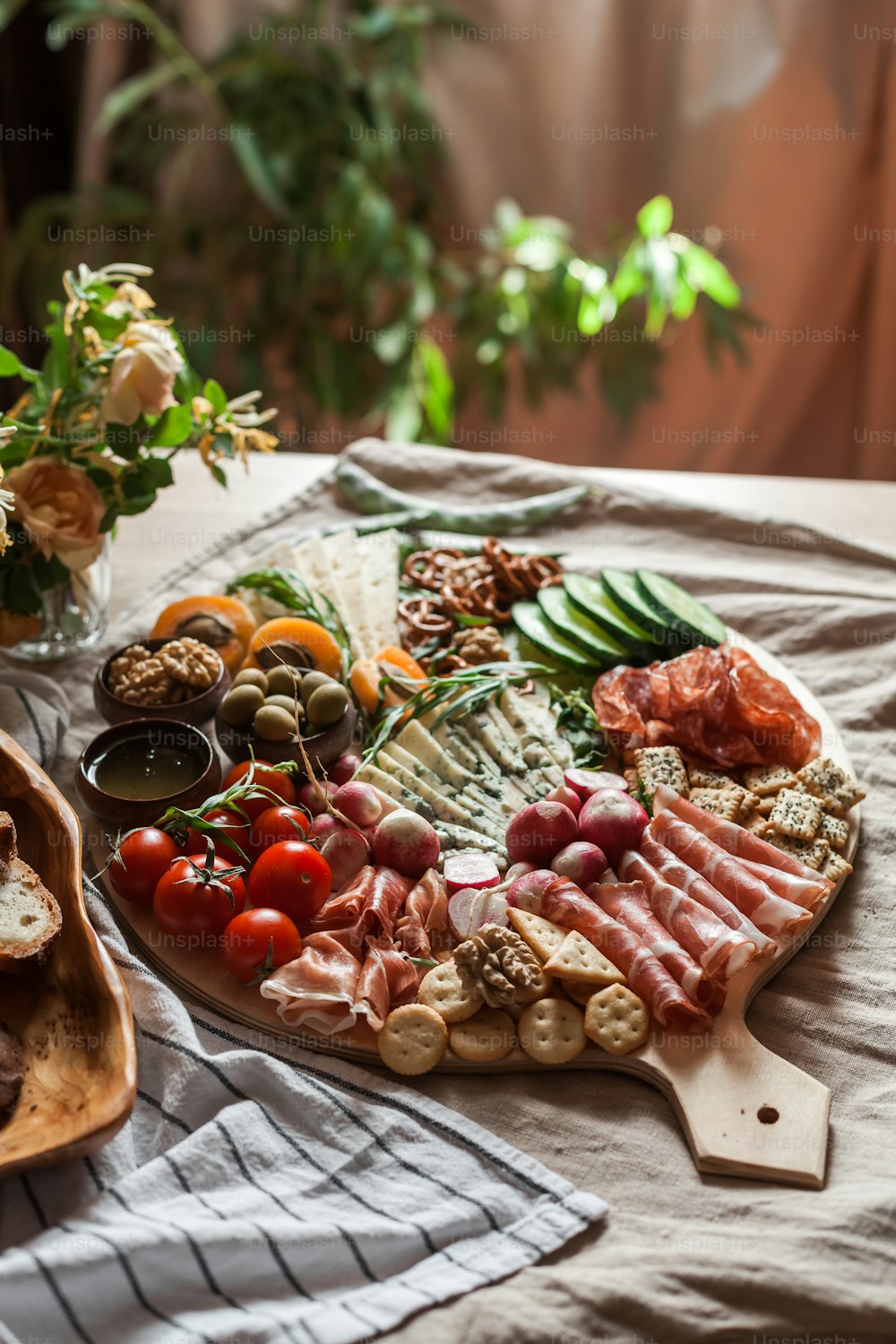 a platter of meats and vegetables on a table