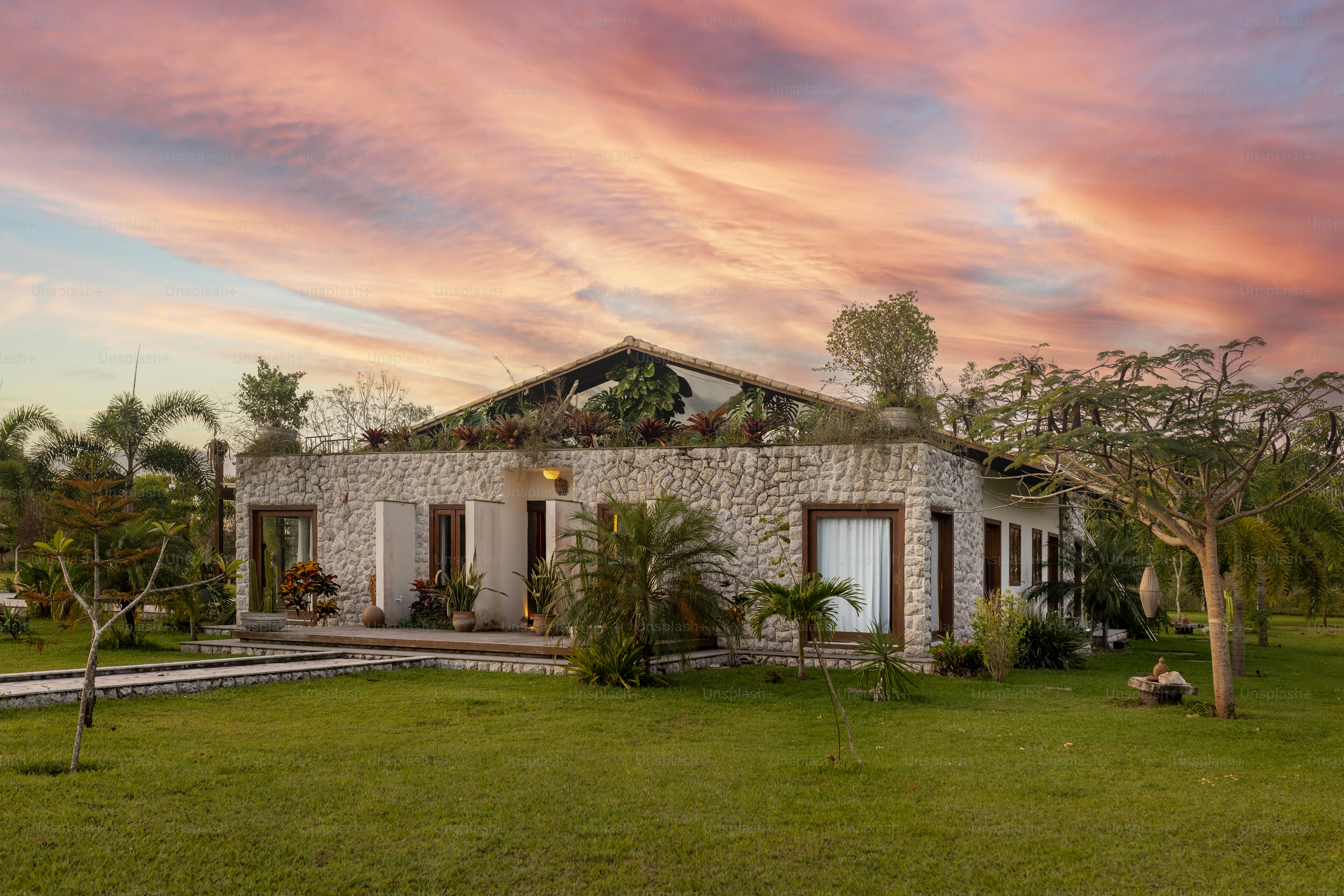 a house with a green lawn in front of it