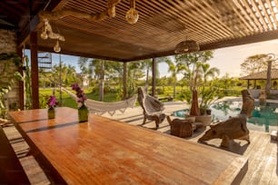 a wooden table sitting on top of a wooden deck