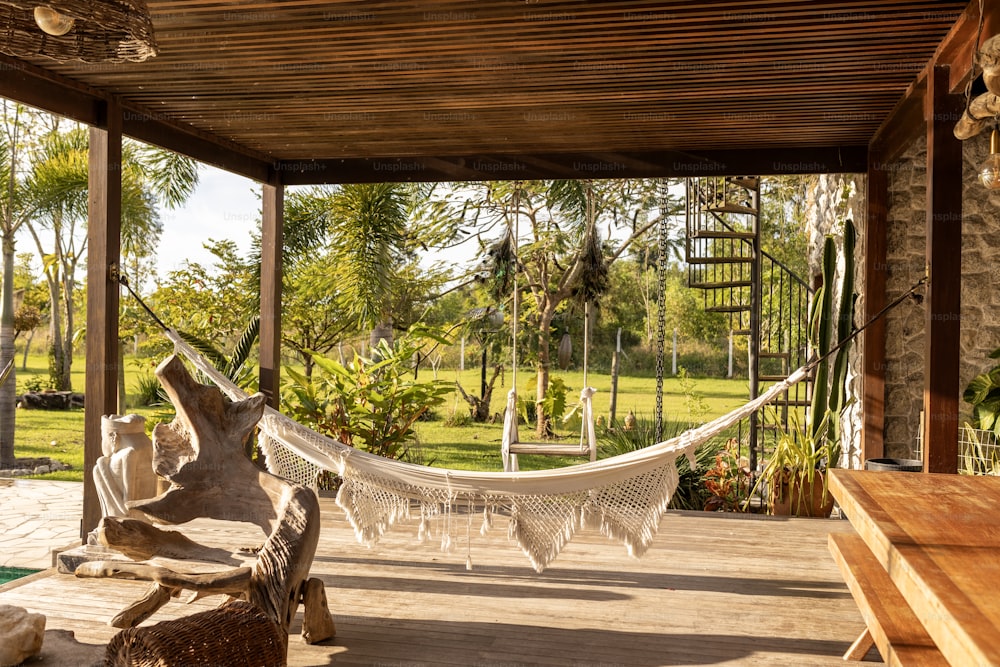 a hammock hanging from a wooden structure