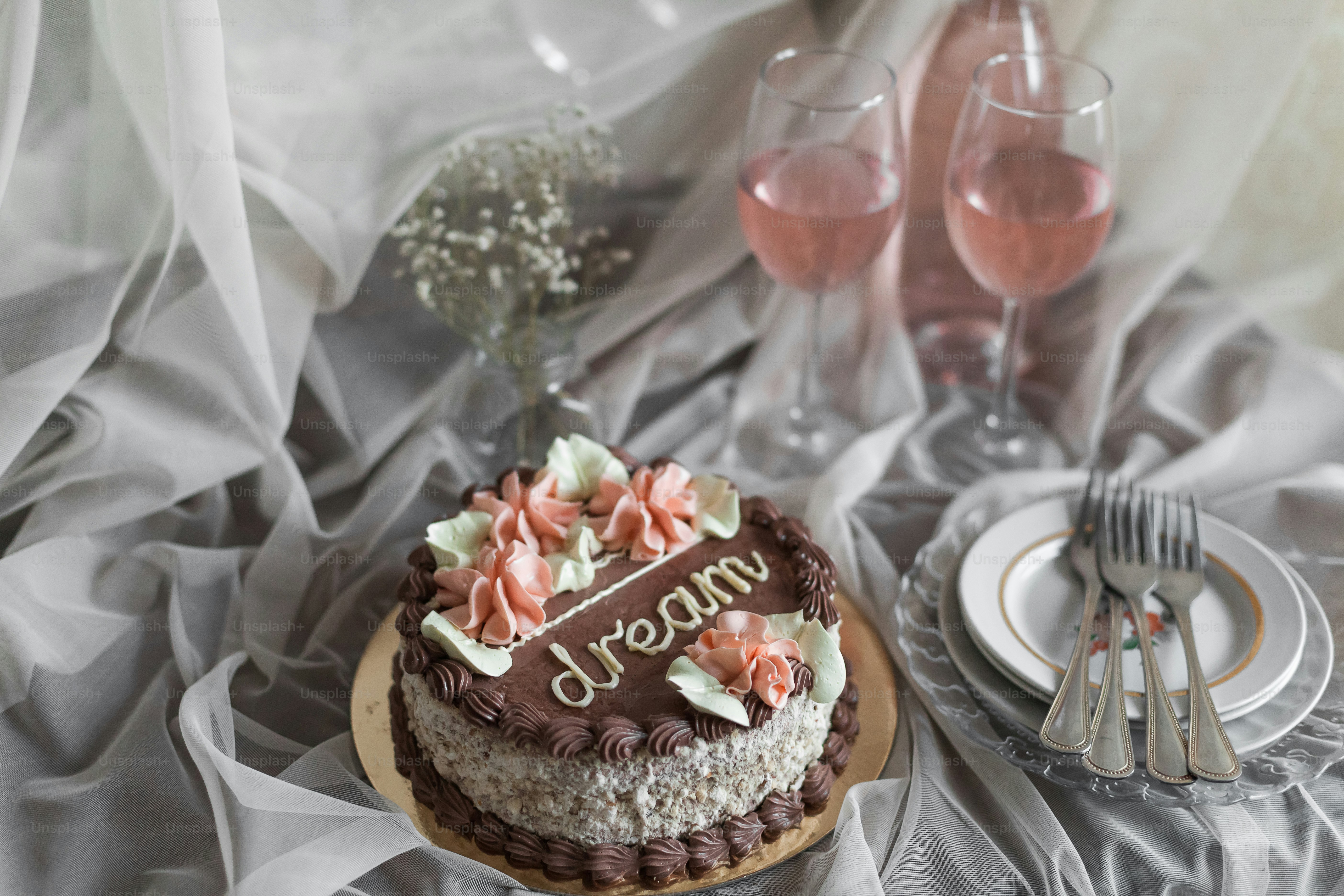 a chocolate and white cake sitting on top of a table