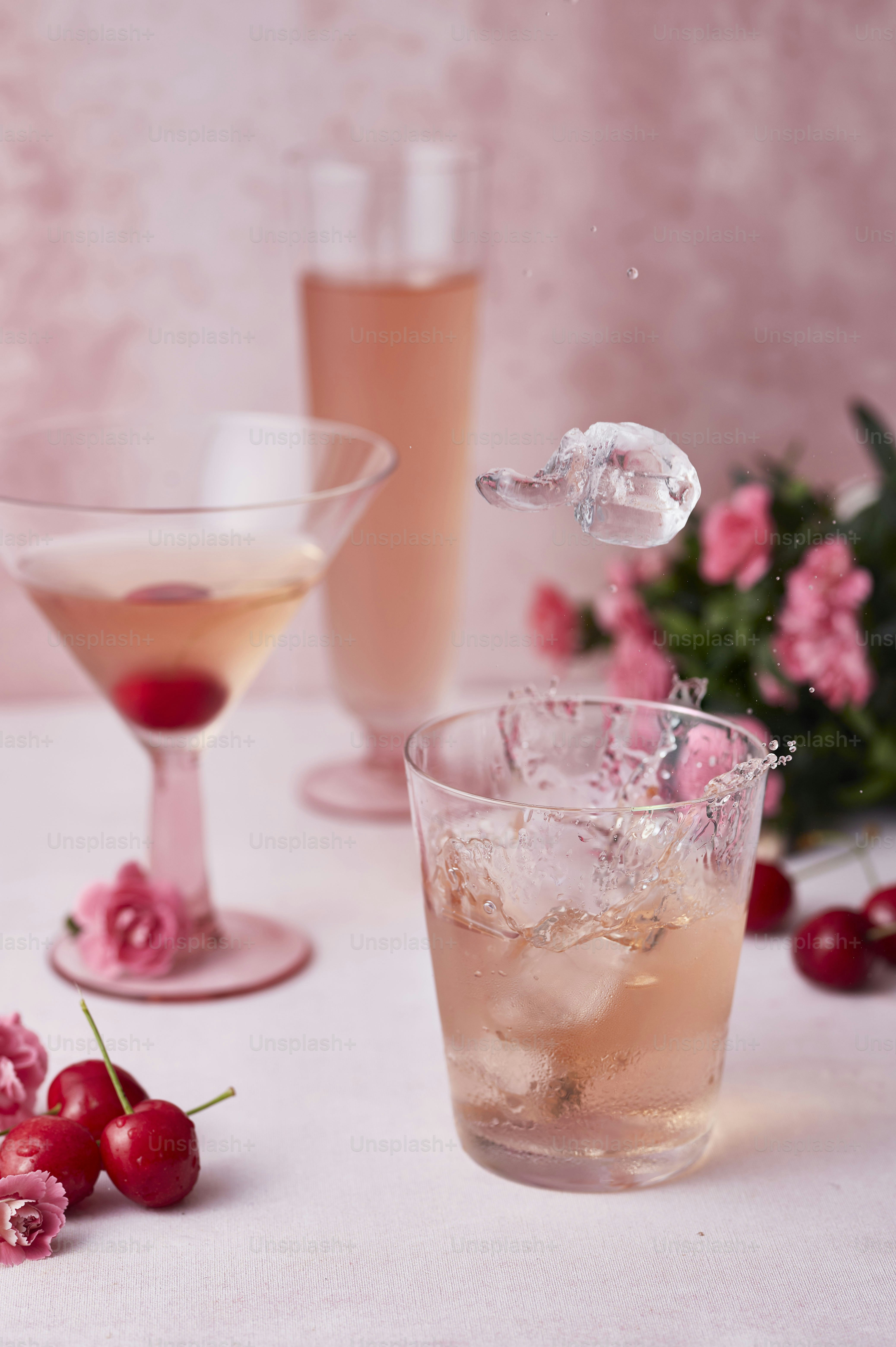a table topped with glasses filled with drinks