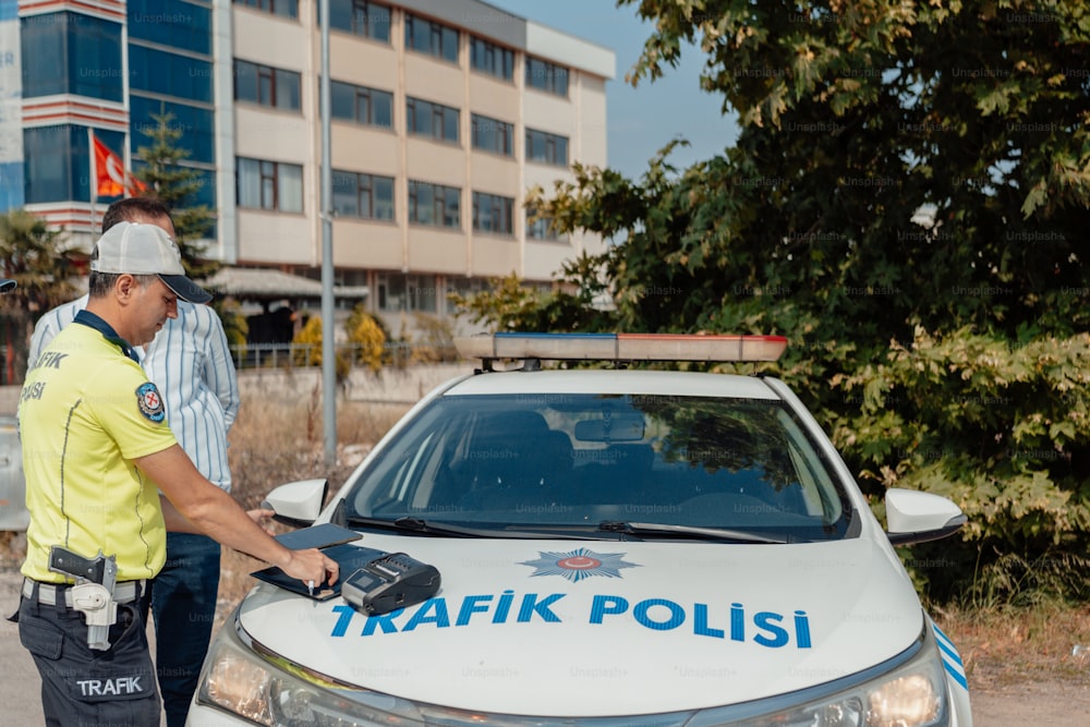 a police officer standing next to a police car