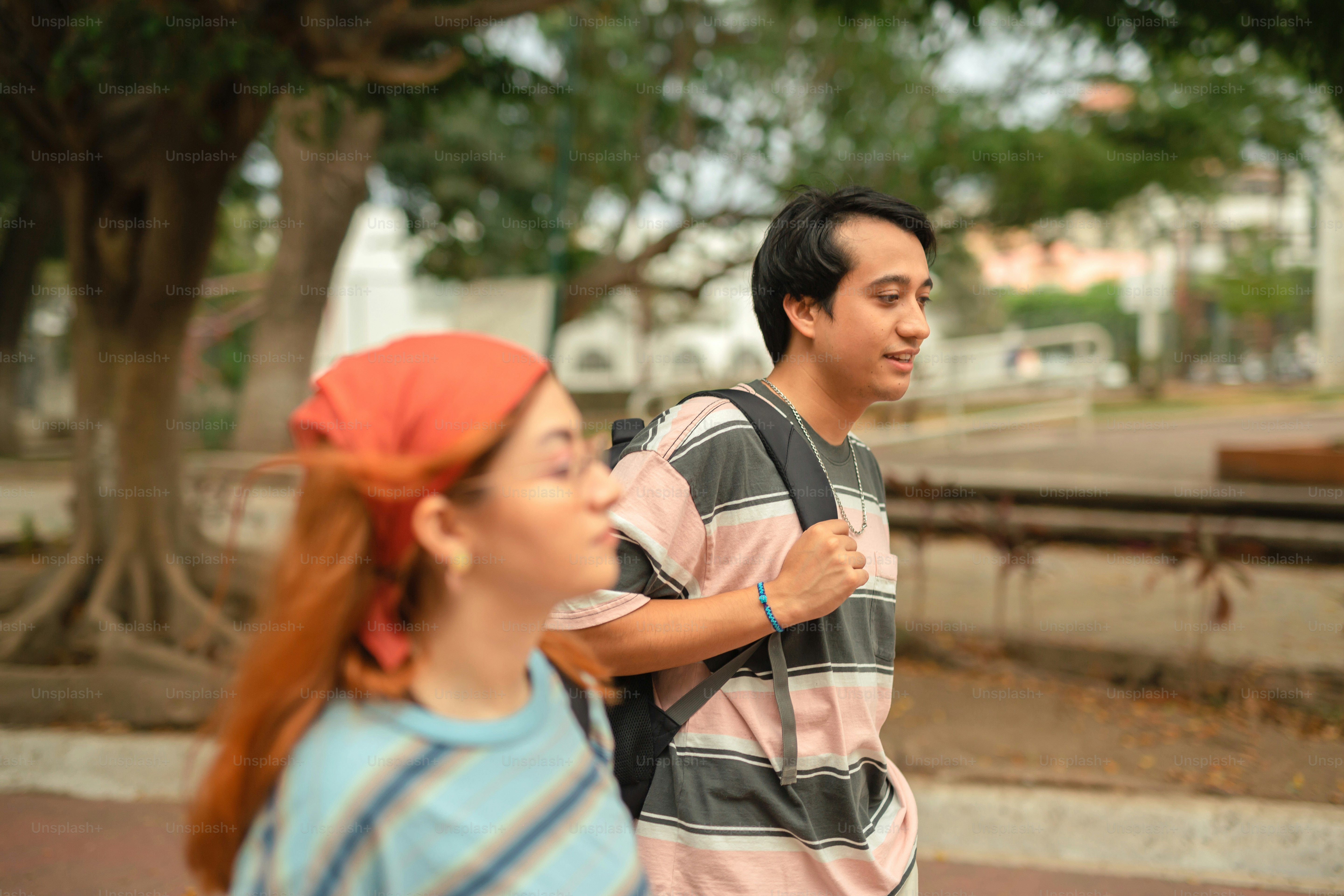 a man and a woman walking down a street