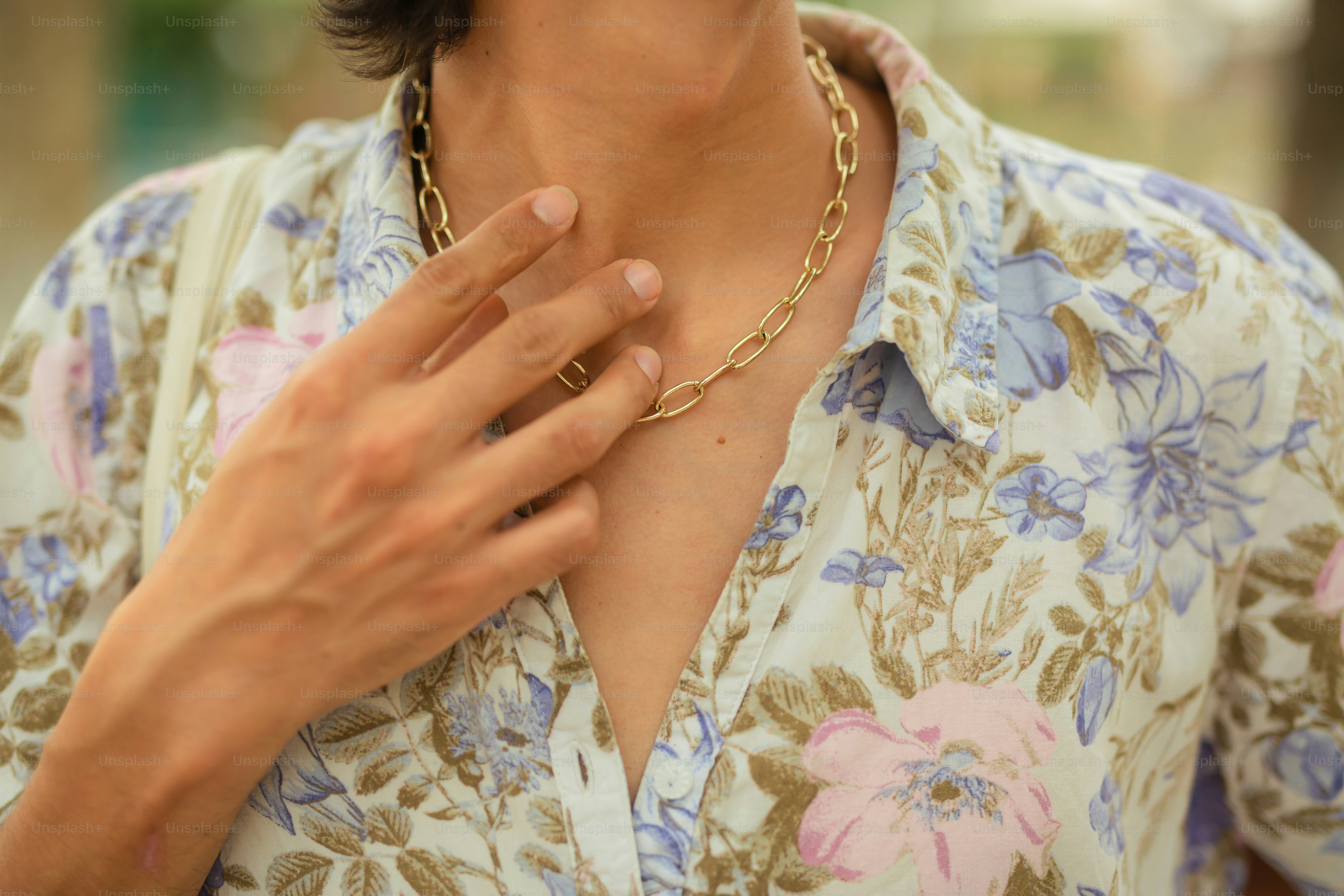 a close up of a person wearing a necklace