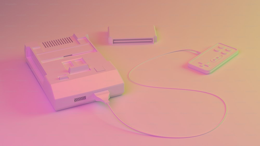 Una consola de juegos y un controlador de Nintendo Wii sobre un fondo rosa