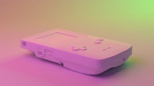 a pink nintendo wii game controller sitting on top of a table