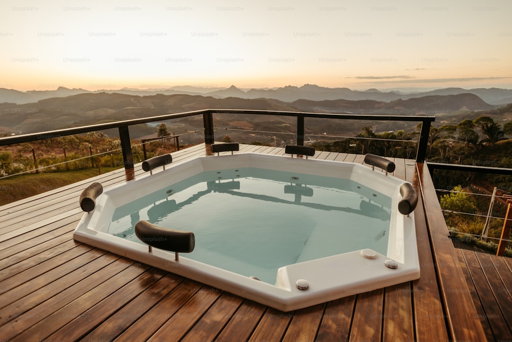 a hot tub sitting on top of a wooden deck