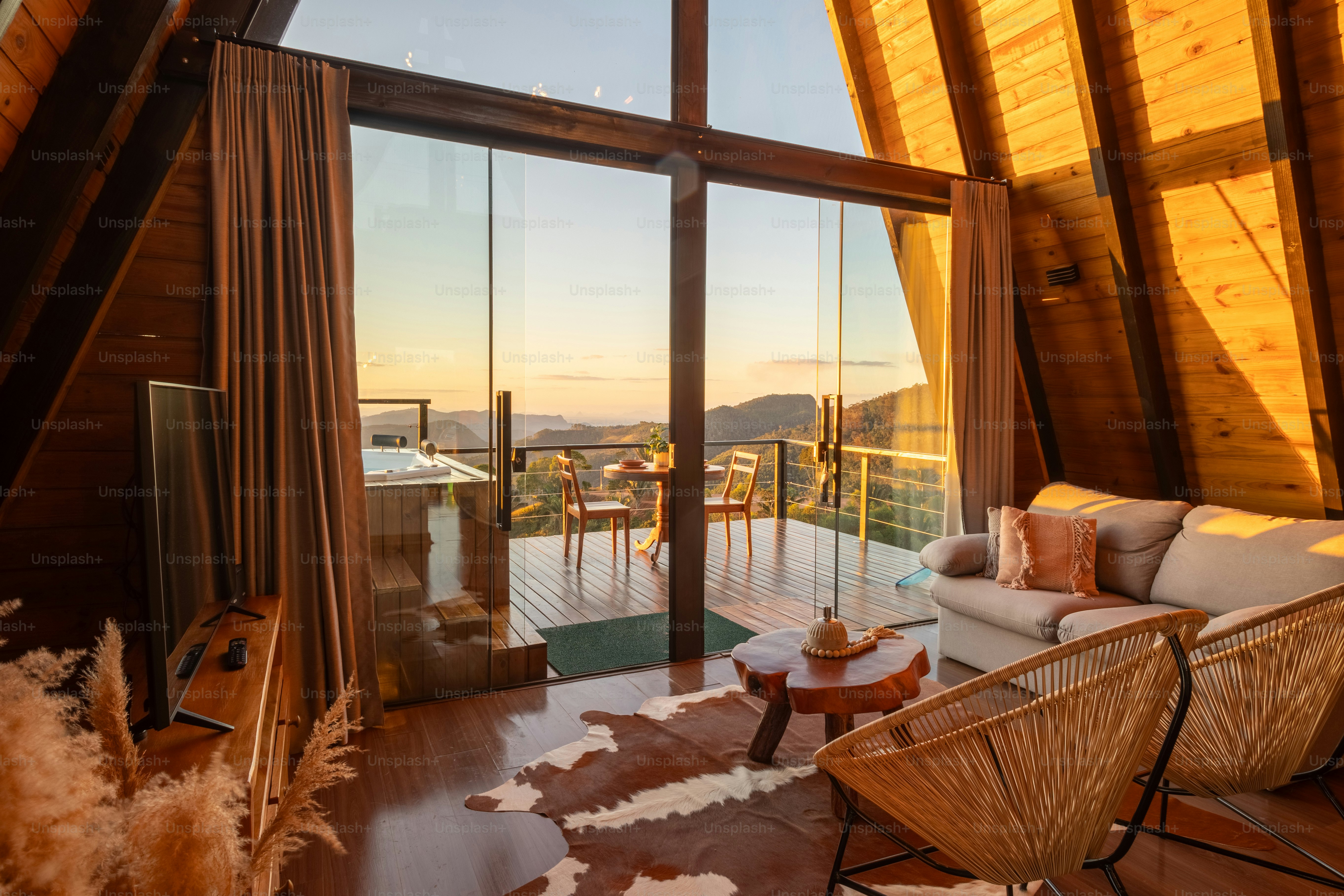 a living room filled with furniture and a large window