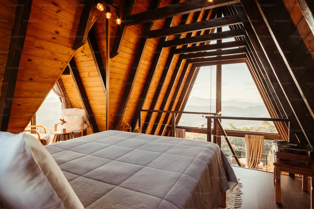a bedroom with a large bed in a loft