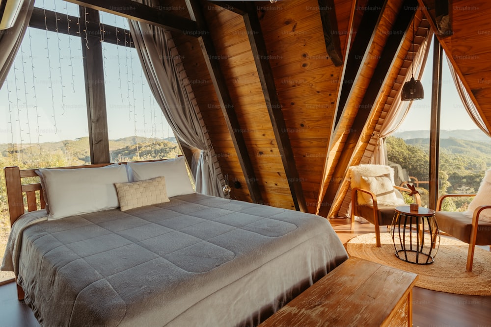 a bed in a bedroom with a view of the mountains