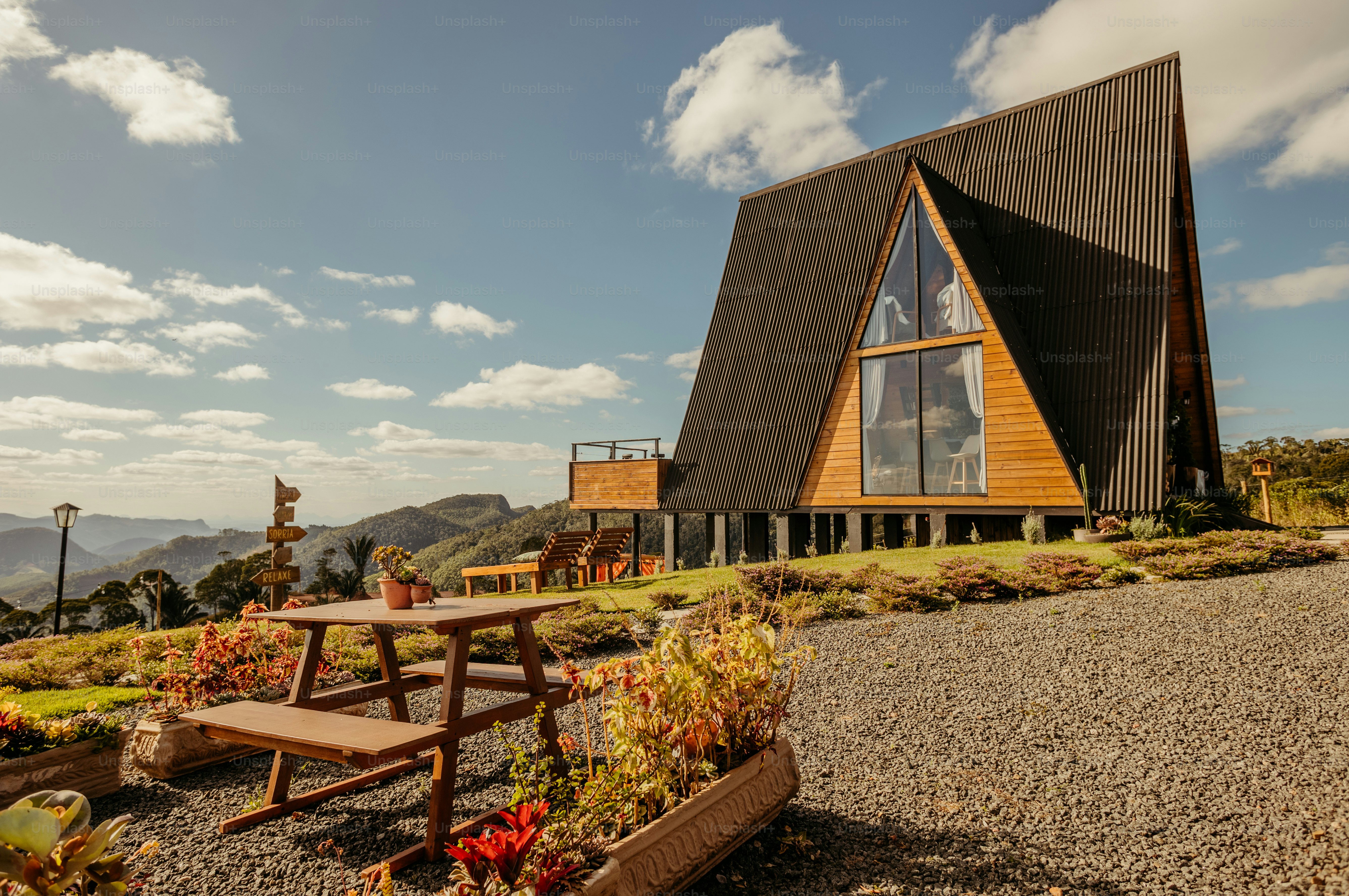 a wooden building with a picnic table in front of it