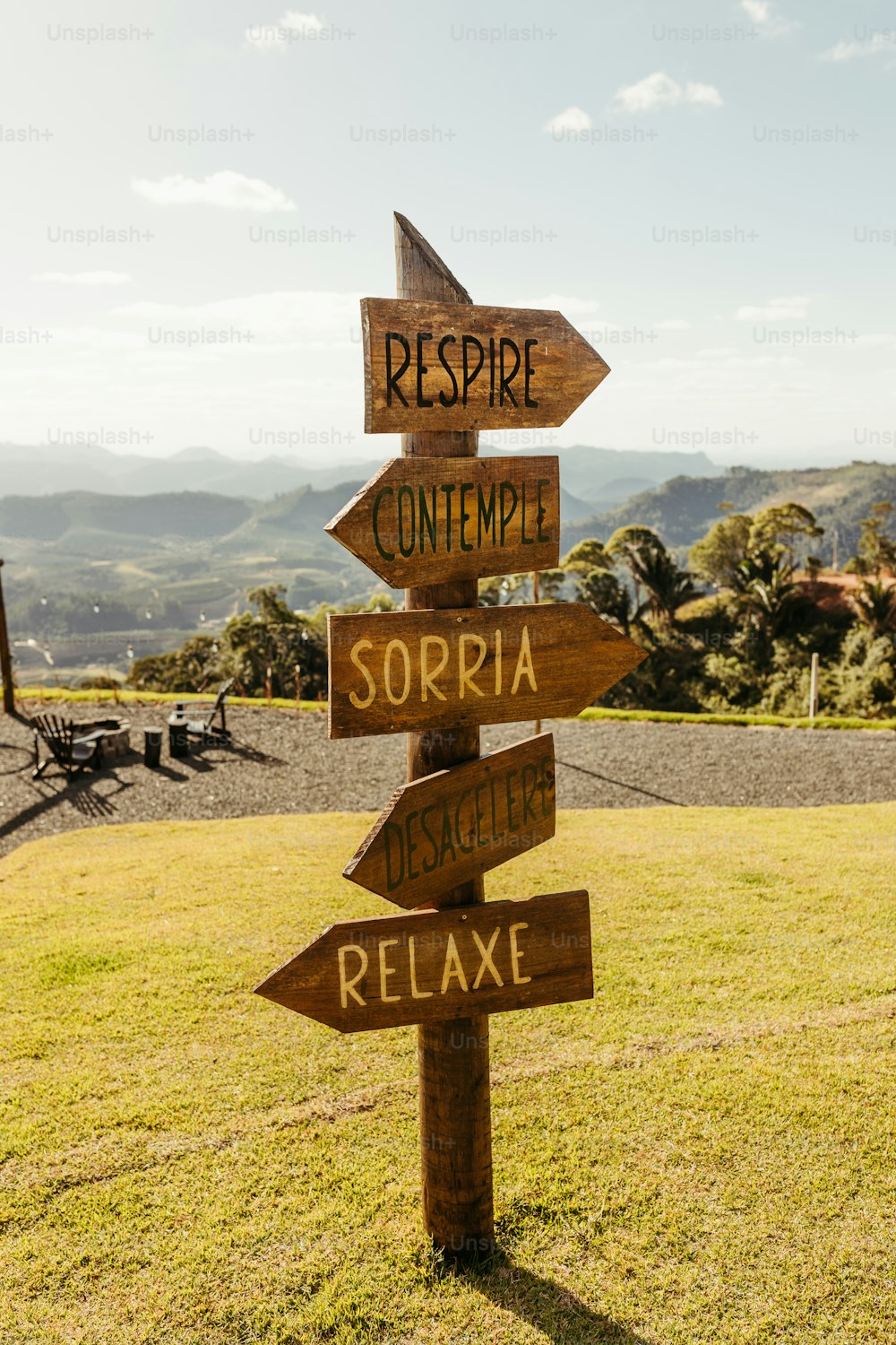 a wooden sign pointing in different directions