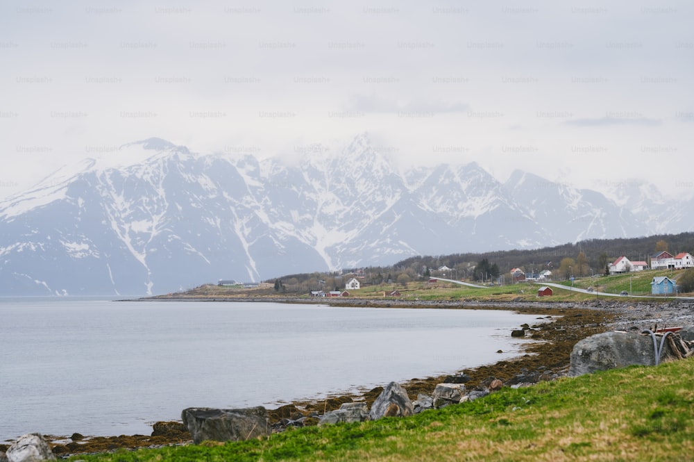 a view of a mountain range with a body of water in the foreground