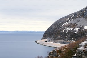 a mountain with a body of water in the middle of it