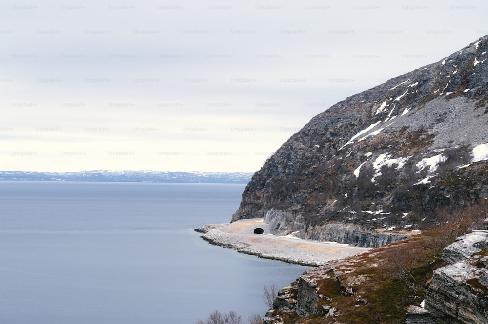 a mountain with a body of water in the middle of it