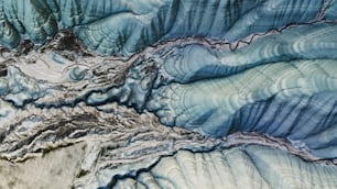 an aerial view of a mountain range in the mountains