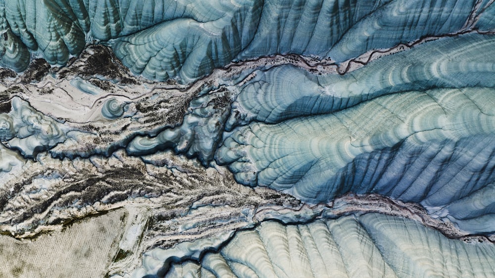 an aerial view of a mountain range in the mountains