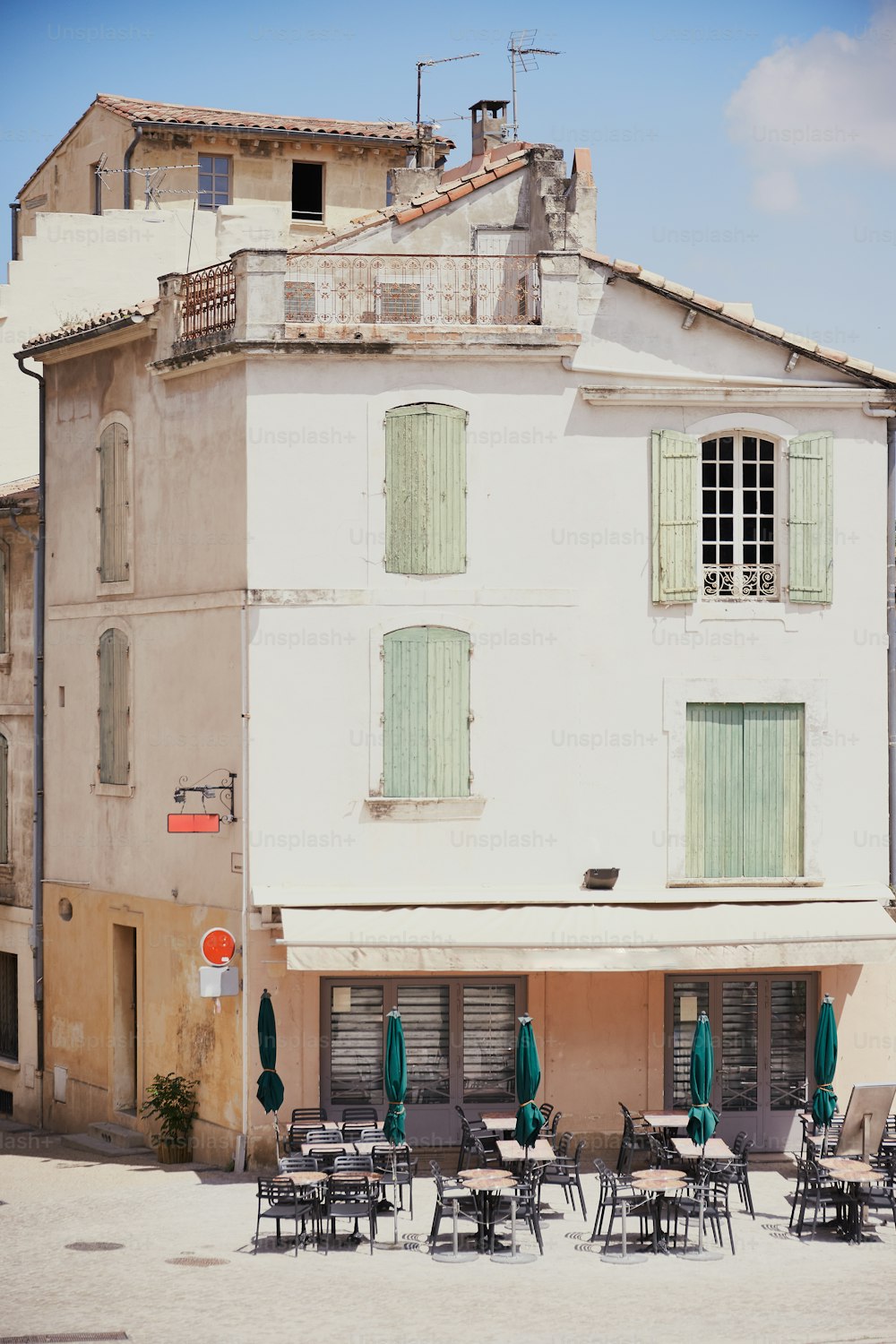 a building with tables and chairs outside of it