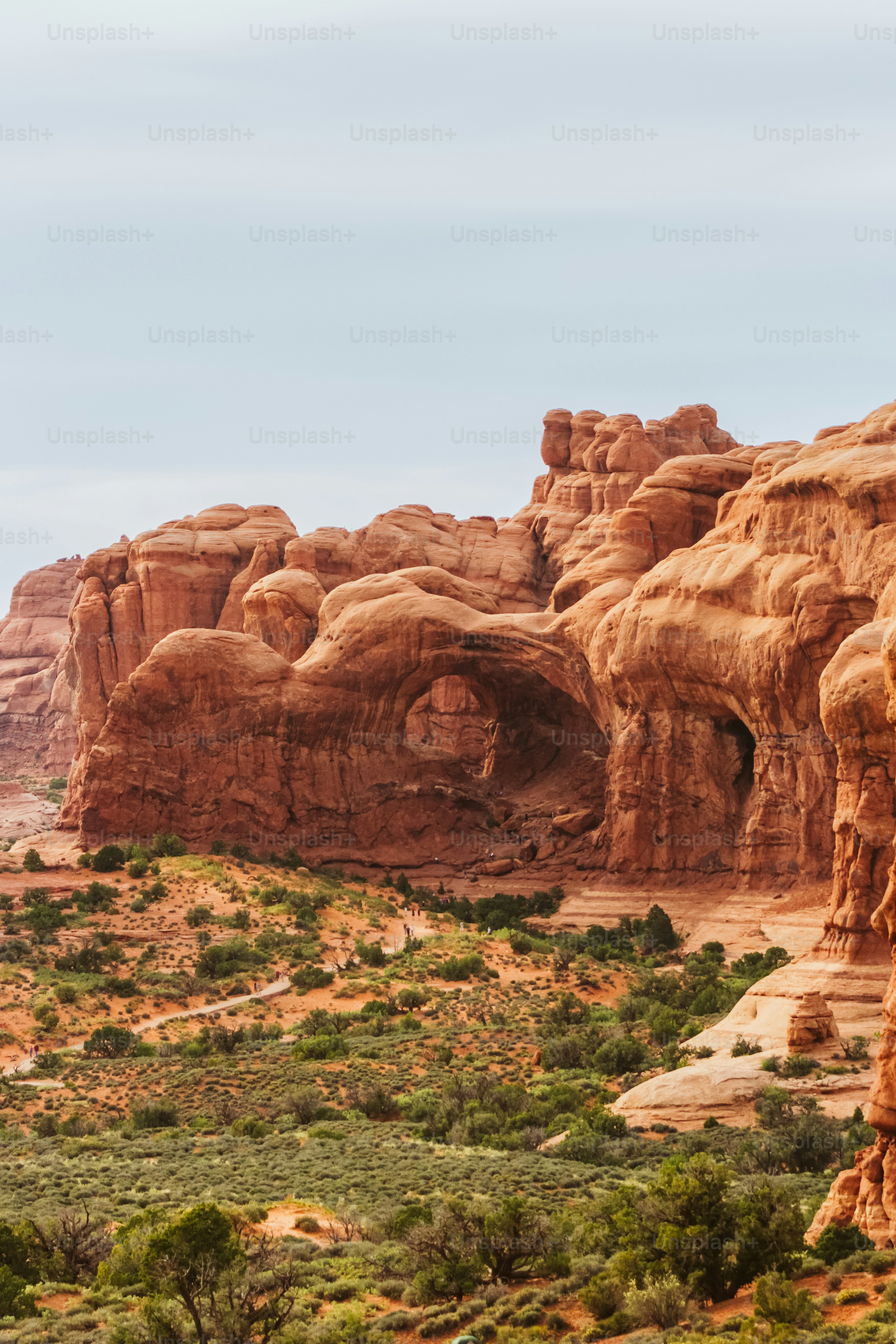 a large rock formation in the middle of a desert